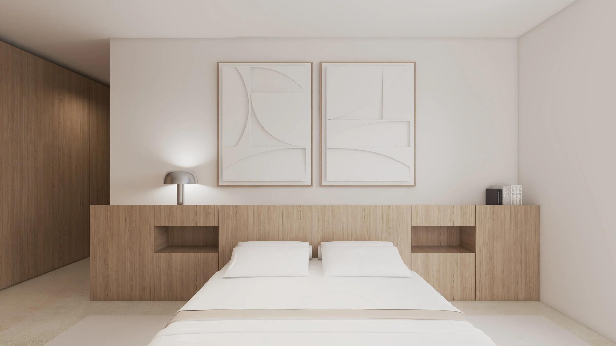Quarto minimalista com cama de casal, cabeceira de madeira, duas obras de arte brancas na parede, luminária ao lado da cama e livros na superfície