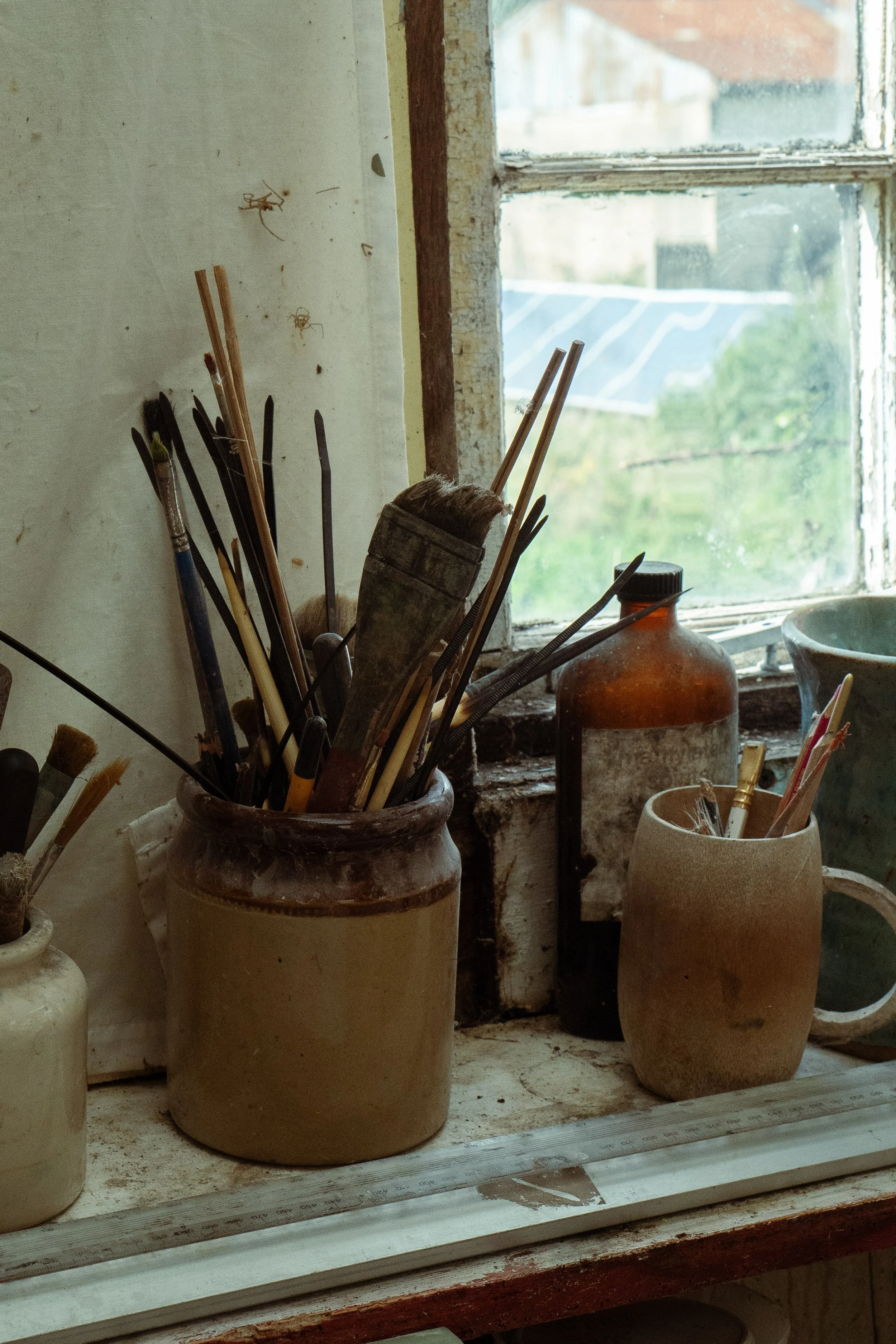 Earthenware pot of artists tools