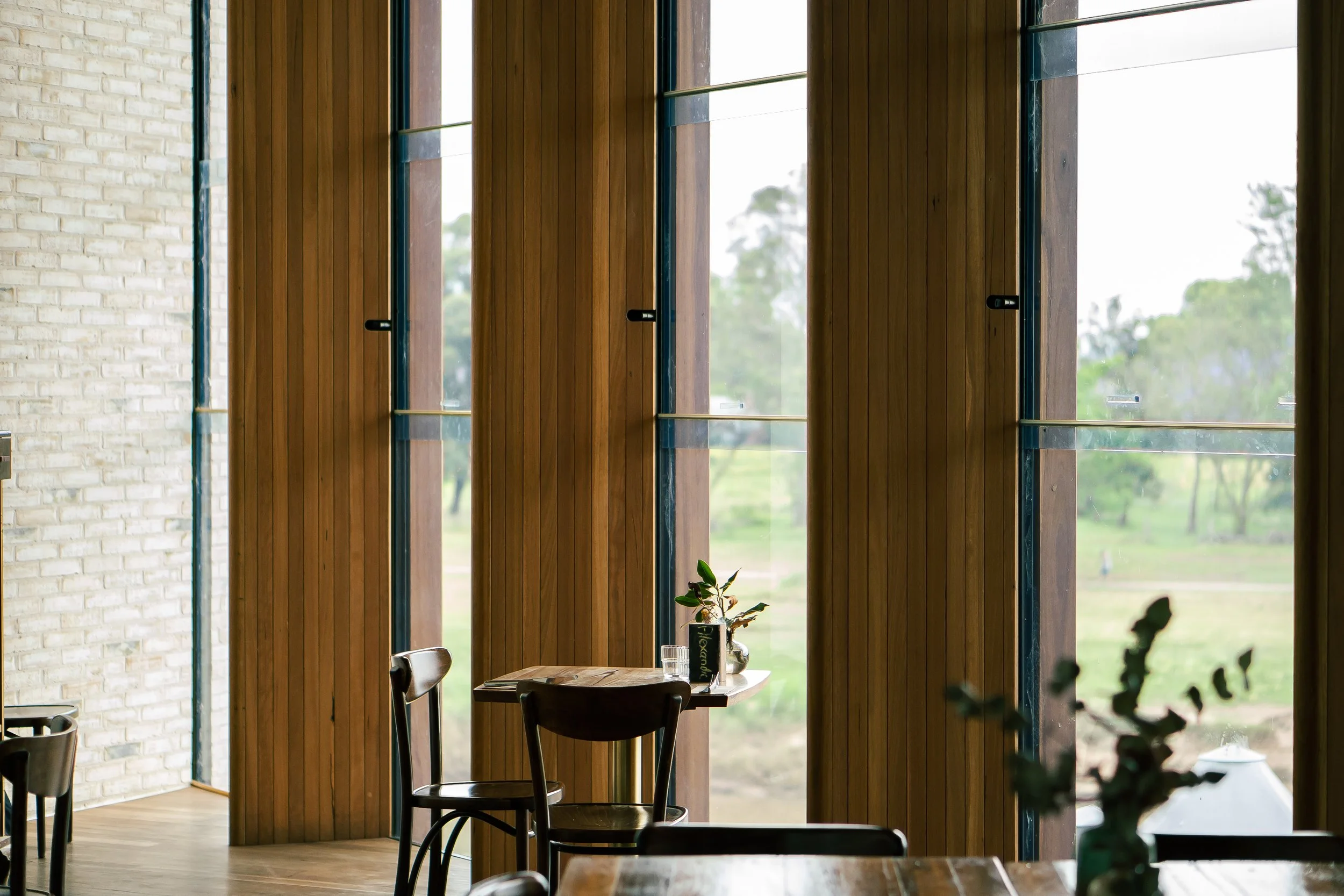 Restaurant table overlooking a river, architectural photography
