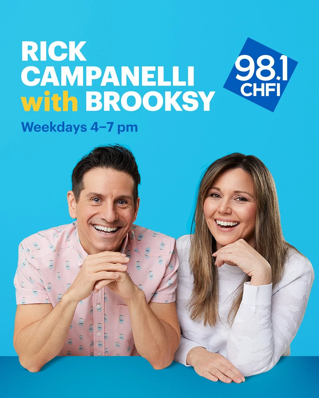 Poster advertising the radio show 'Rick Campanelli with Broksy' on 98.1 CHFI, airing weekdays from 4 to 7 pm, featuring a smiling man in a pink shirt and a woman in a white shirt sitting at a blue table with a blue background.