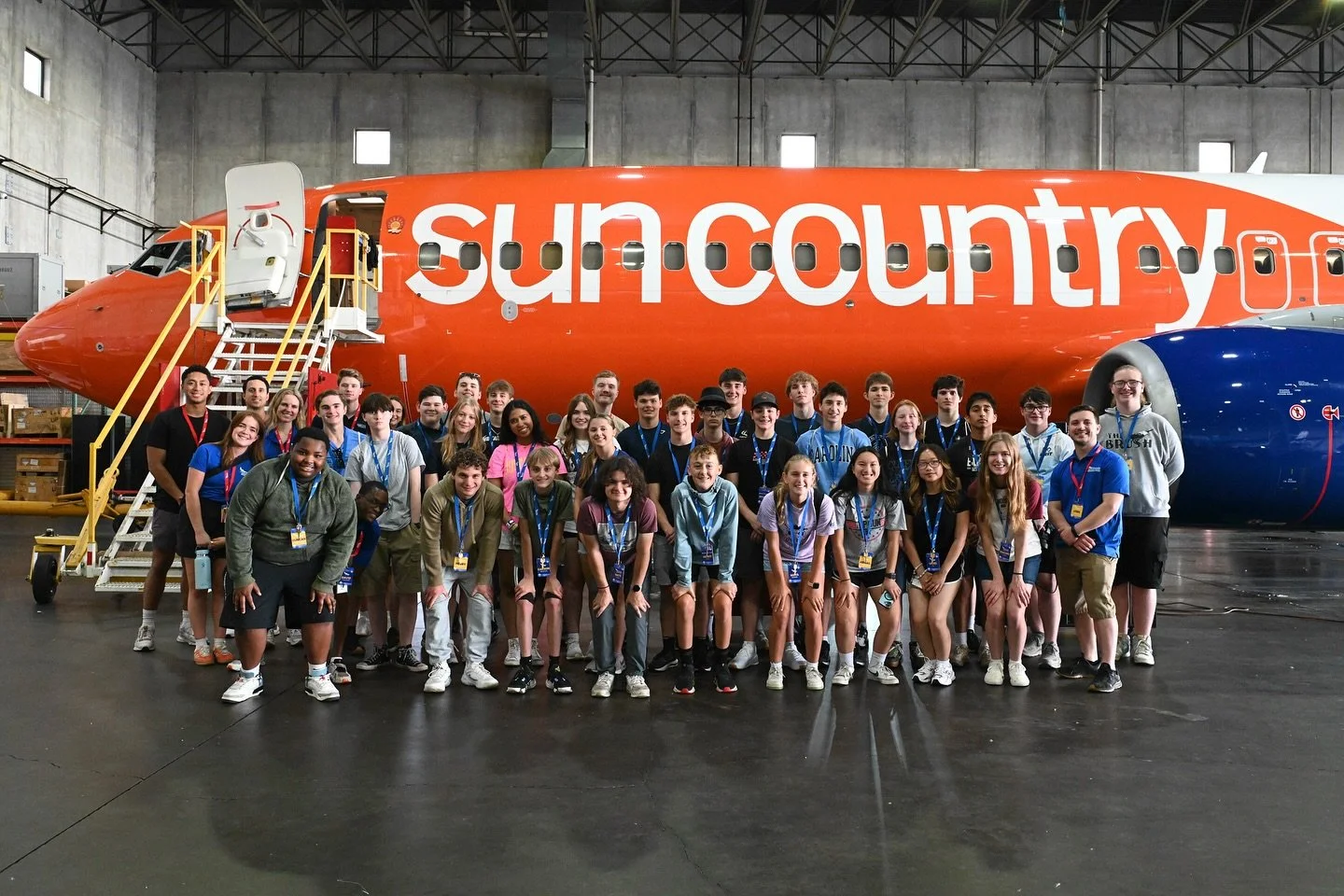 Minnesota Aviation Career Education (ACE) Camp participants outside of Sun Country Plane.