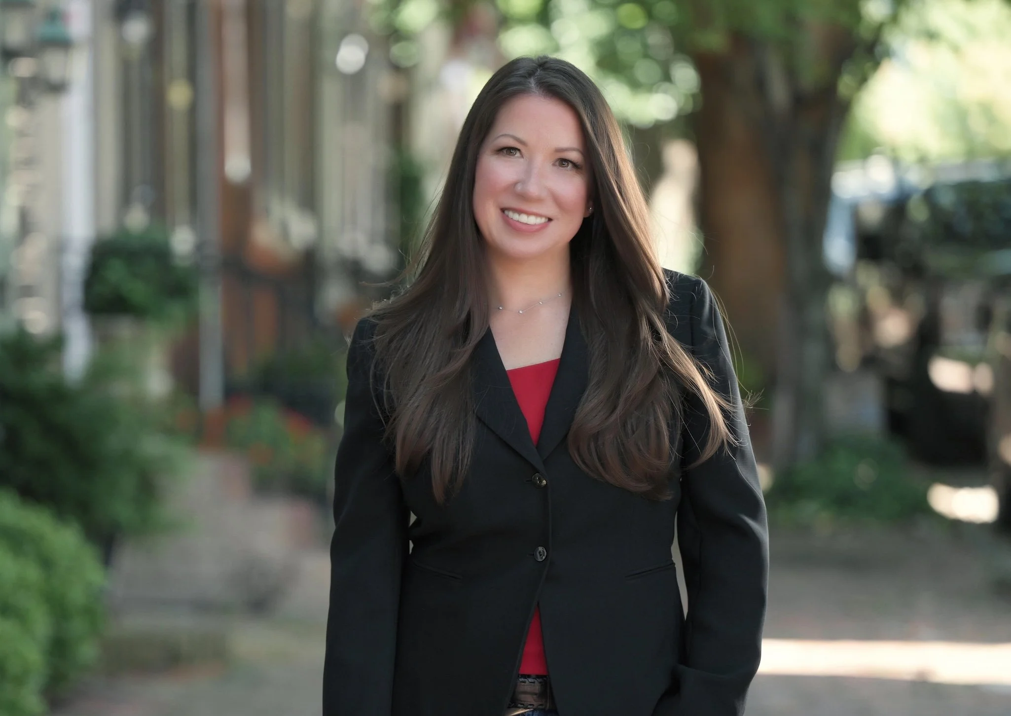Carol Sosalla, founder of Hit Interview, smiling outdoors in a professional headshot representing executive resume writing and branding expertise.