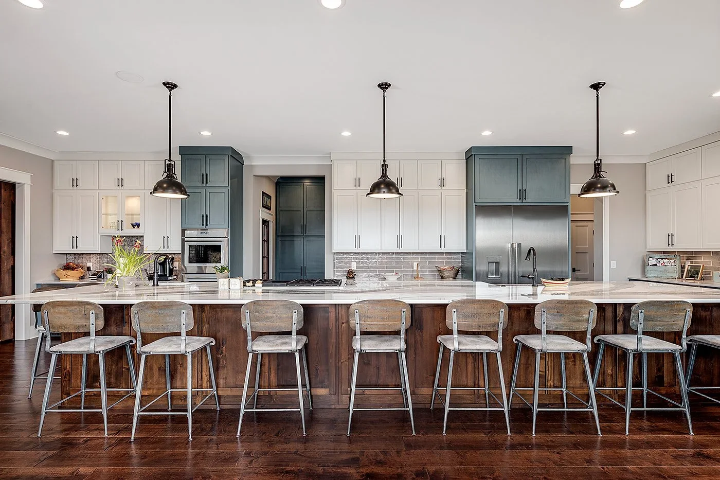 Kitchen Renovation in Greenville SC with large island, 8 stools, overlooking appliances, cabinetry, fixtures and finishes.webp