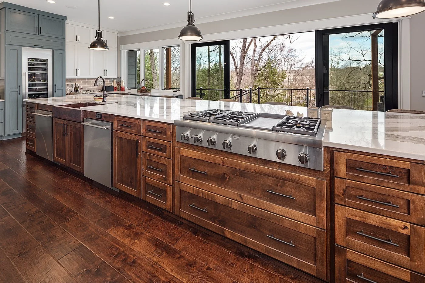 Kitchen Renovation in Greenville SC backview of large island outwards towards open sliding doors and patio.webp