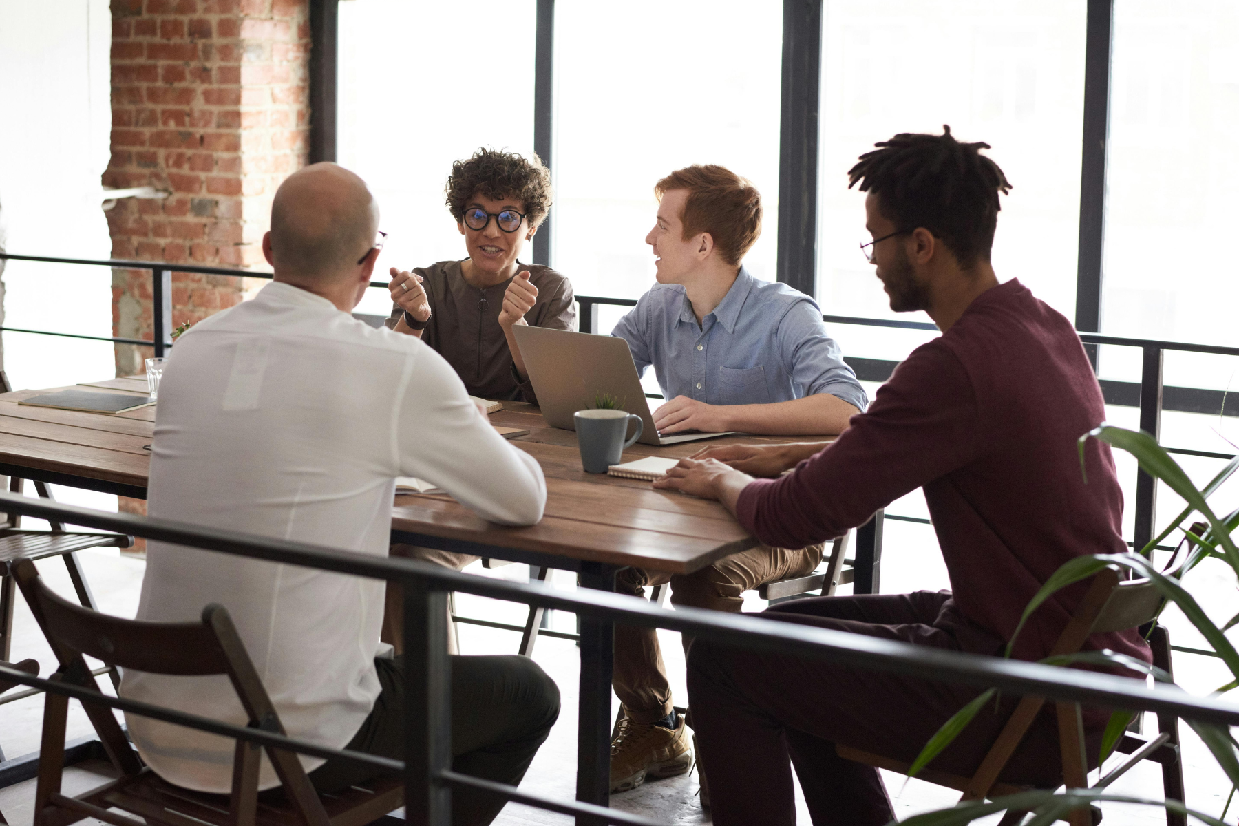 Team brainstorming ideas during leadership development program