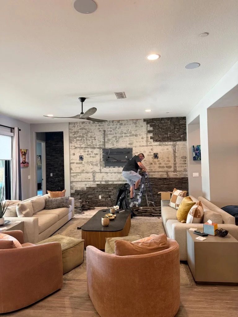 Began by removing the television, light fixtures, and brick. 