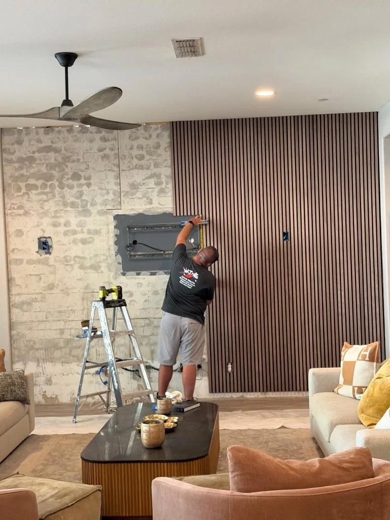 The process of installing the new sound board panels. 