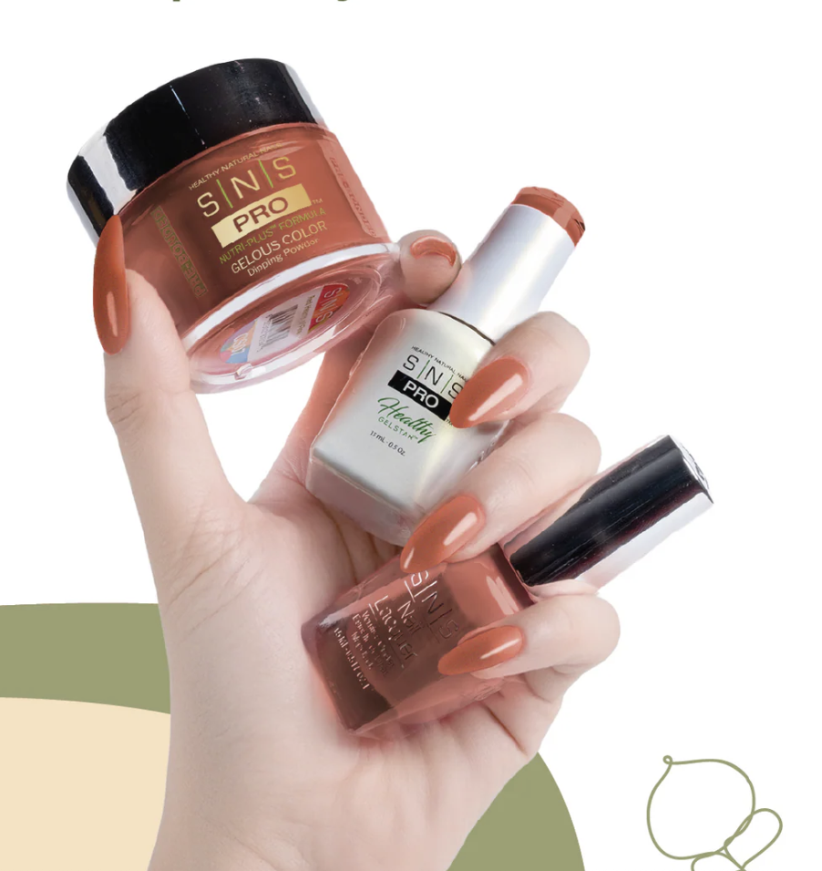 Hand with orange nail polish holding three jars of nail polish, two in brownish shades and one in white with a peach color, against a minimalist background.