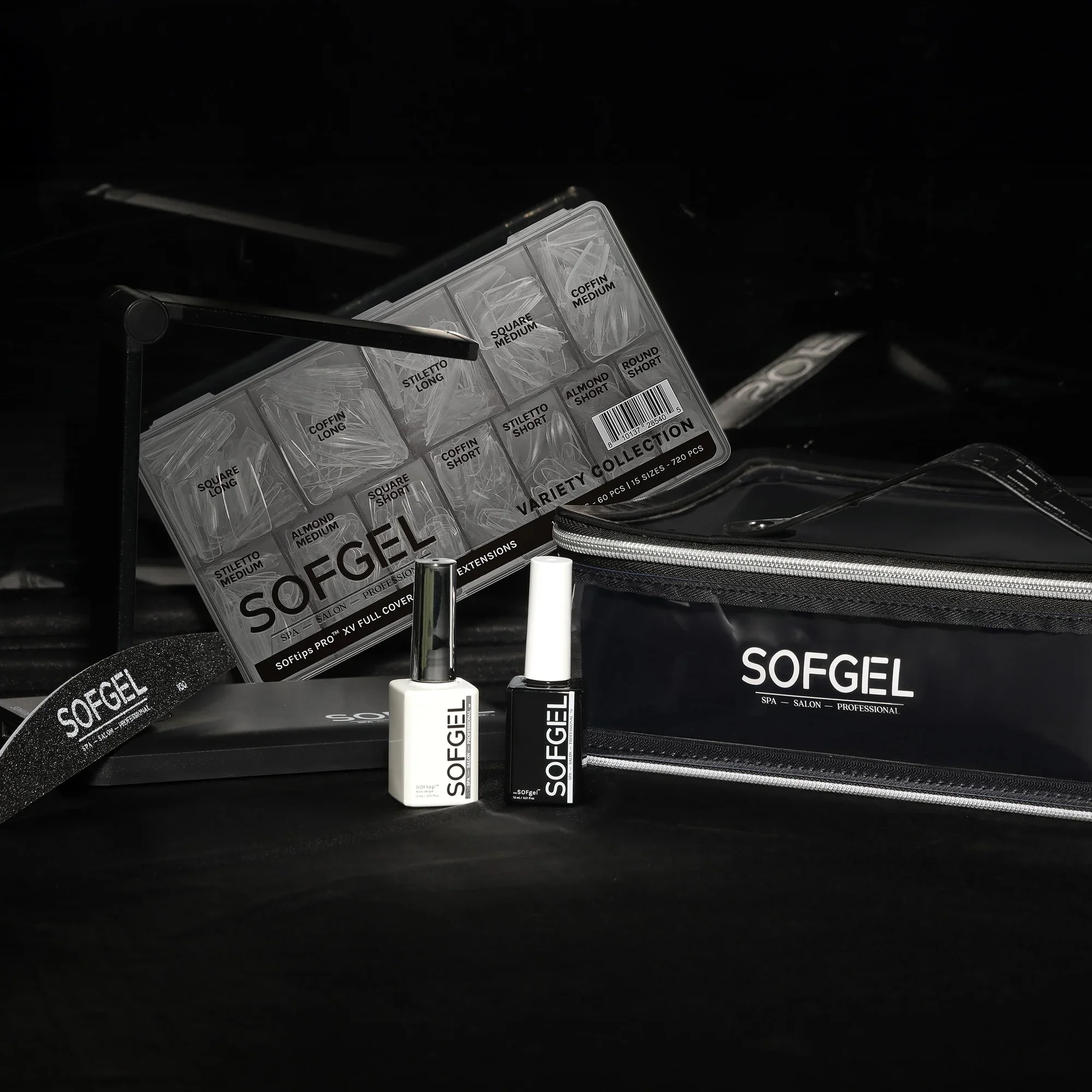Sofgel nail extension kit with brushes, a storage box, and a black carrying case on a black surface.