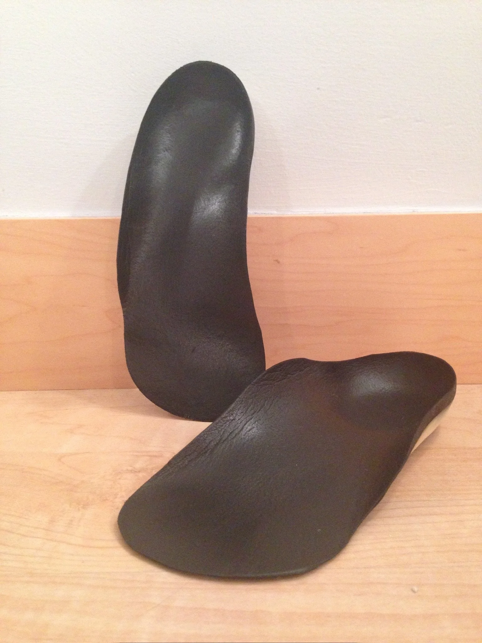 Custom orthotics demonstrating individualized foot support for movement and posture education.