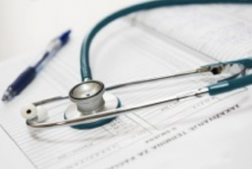 photo of patient information, pen, and stethoscope.