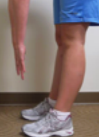 Image showing a person unable to place feet or hands on the floor, demonstrating limited flexibility or mobility.