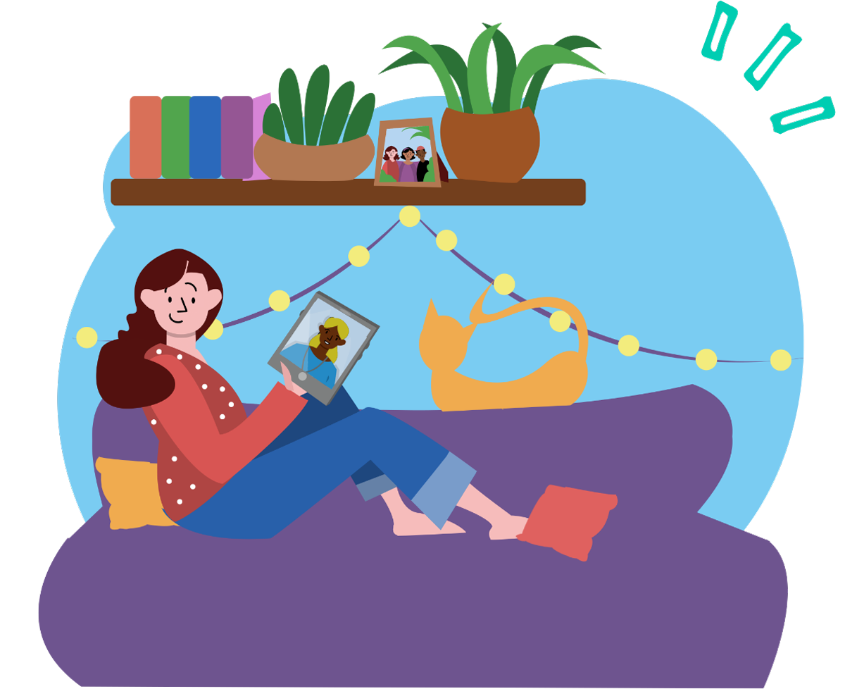 A girl with long brown hair, wearing a red jacket with white polka dots, sits on a purple couch with a yellow pillow in a cozy room. She is holding a framed photo of a dog. There is a ginger cat lying on her lap. A wooden shelf above her holds potted plants, a framed photo of three people, and colorful books. String lights are hanging in the background.