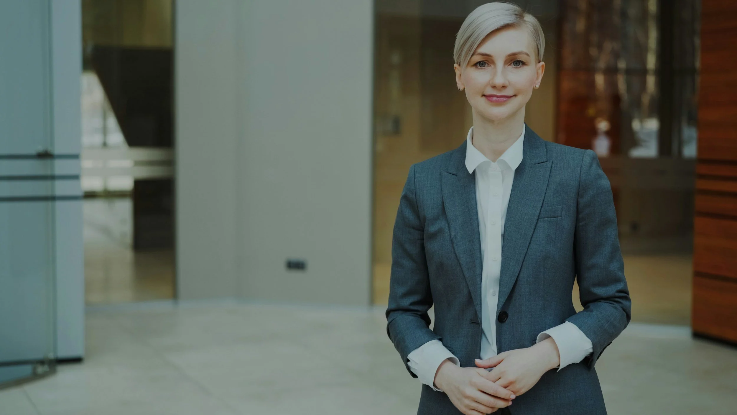 A confident business leader in a modern office — Ark Advisory Group provides hands-on executive and operations consulting in New Jersey