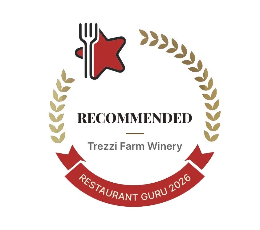 Award badge with a red star, a fork, and a laurel wreath, indicating a recommendation for Trezzi Farm Winery from Restaurant Guru 2026.