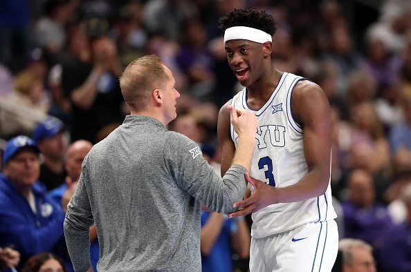 AJ Dybantsa comes out and the end of a games and celebrates with BYU coach Kevin Young.