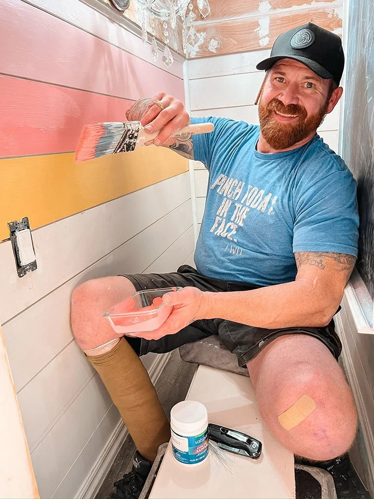 Dan painting the custom designed bunk beds.jpg