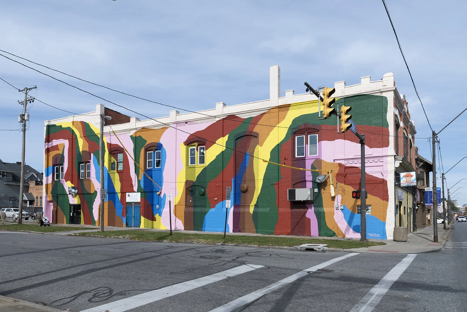 "Glacier Caves," 2022,
Paint on brick and wood,
35' x 100',
Cleveland, OH