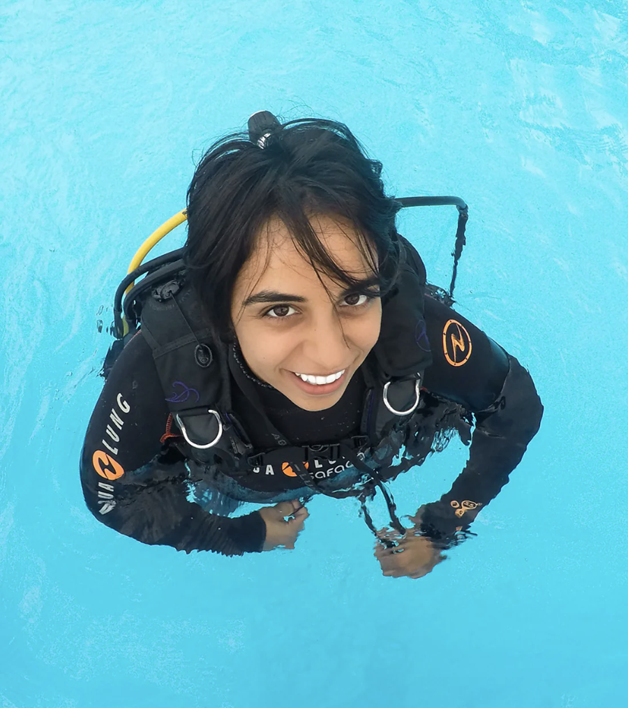 Portrait of scuba diver Nadia Aly in diving gear, photographed underwater.