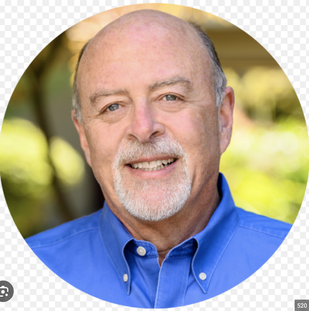 Portrait of photographer Steve Mandel smiling outdoors.