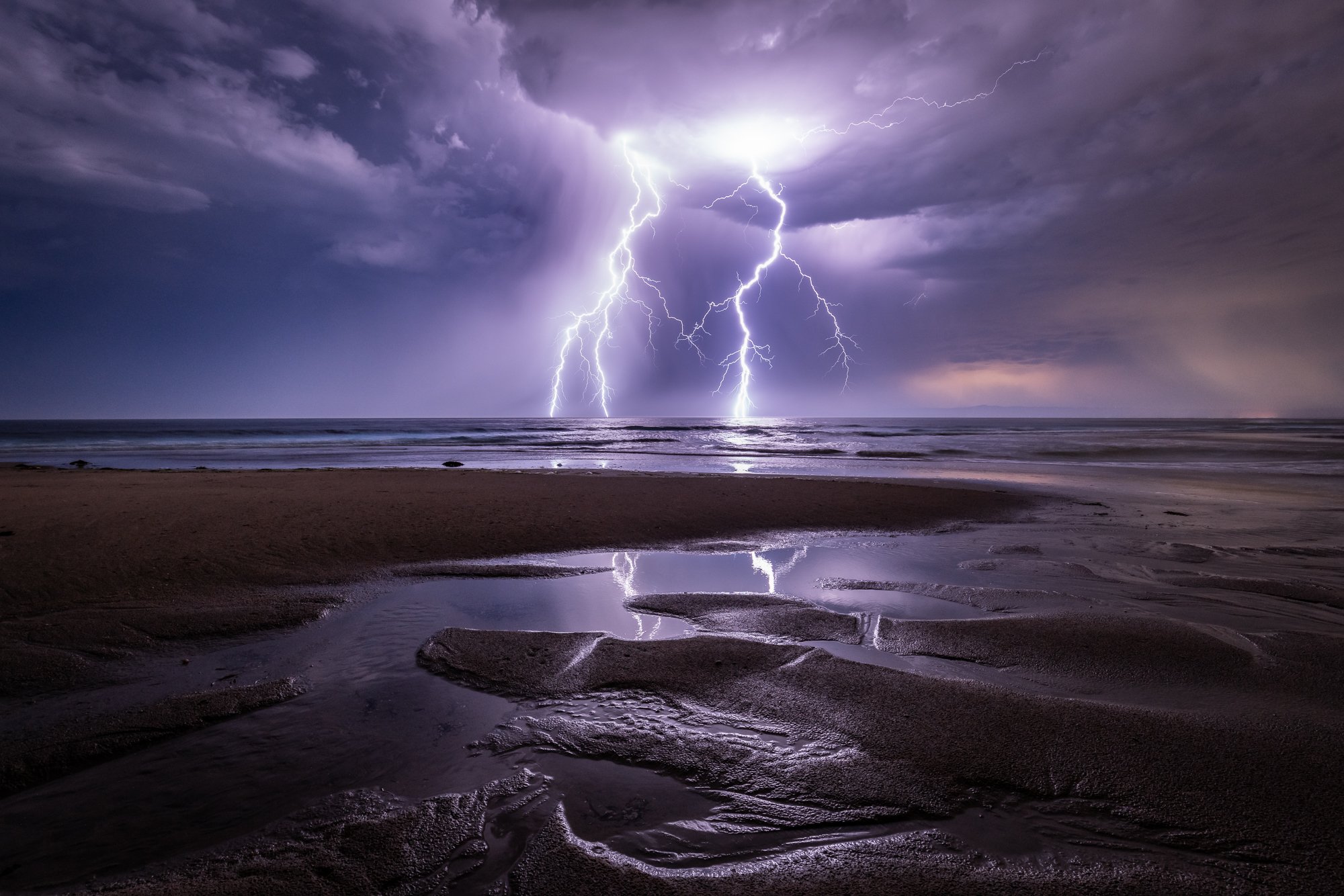 Lightning strikes the Monterey Peninsula in the summer of 20201. In the distance the Santa Cruz fires begin. Image by Joe Platko