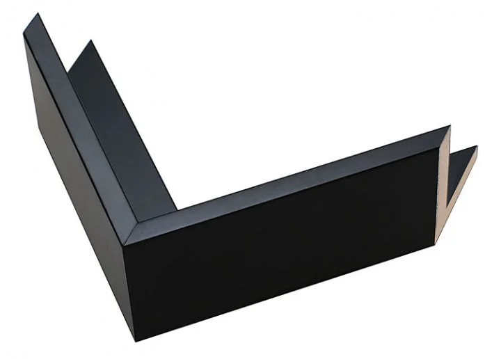 Black L-shaped object with angled edges, viewed from above against a white background.