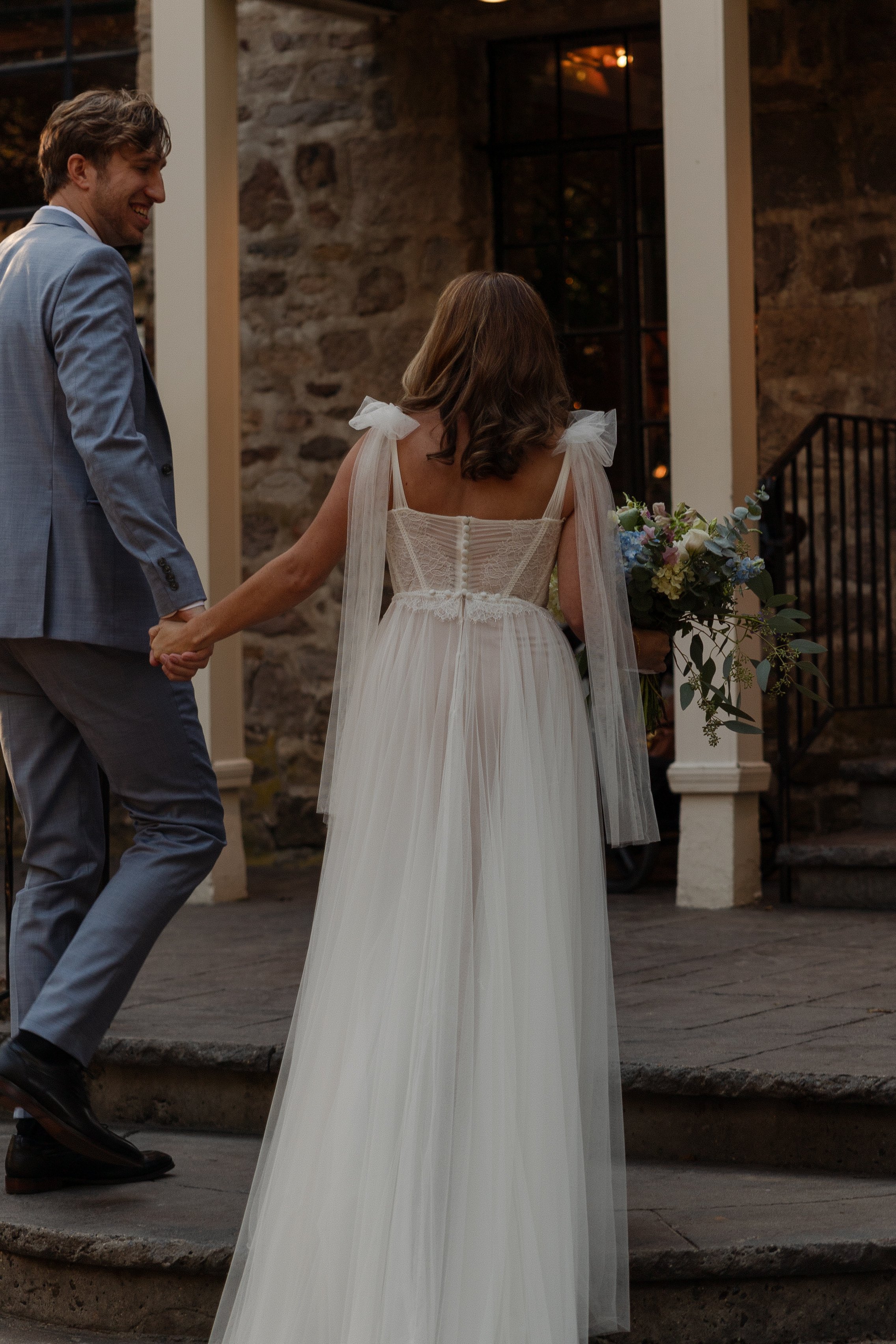 Bride and groom sharing a romantic moment during their wedding in Somerville, New Jersey, photographed by Dominique Paulette.