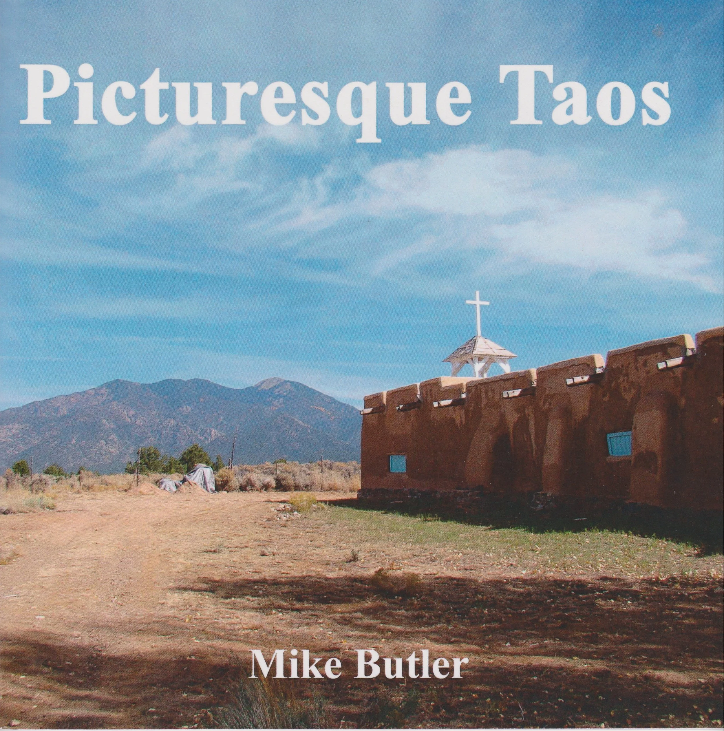 Book cover titled 'Picturesque Taos' by Mike Butler.