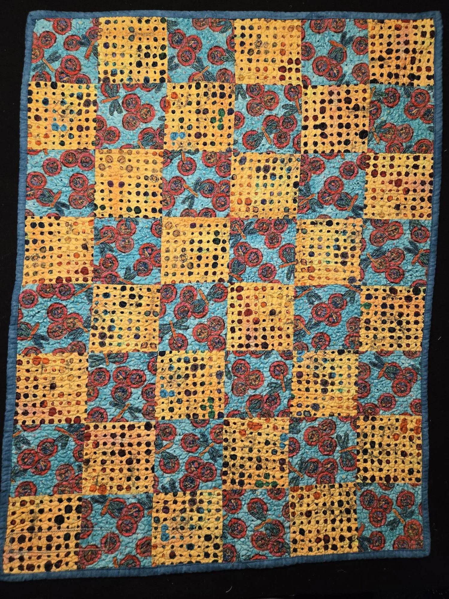 (30"x40") Baby Quilt4 Front View.  Distinct, colourful fabric design baby quilt