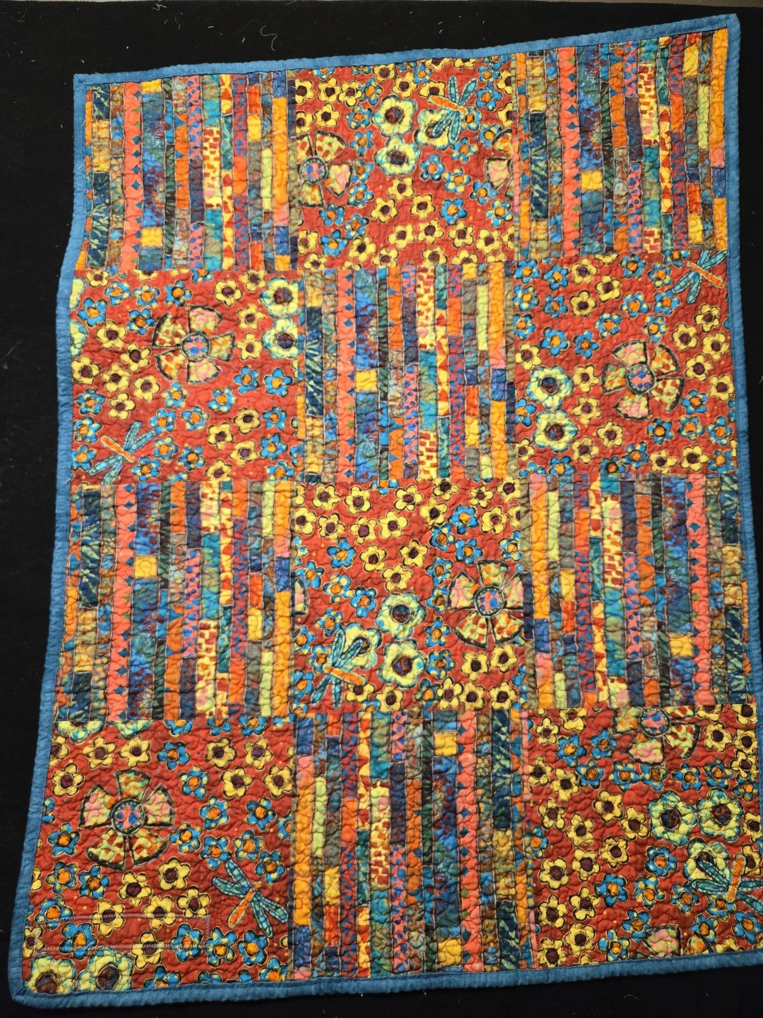 (30"x40") Baby Quilt2 Front View.  Distinct, colourful fabric design baby quilt