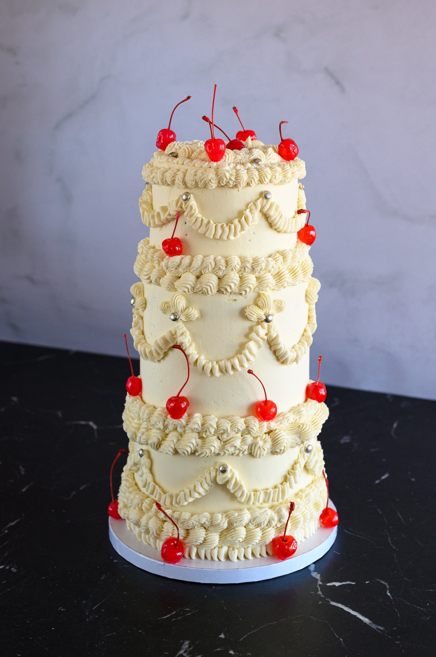 Vintage wedding cake with cocktail cherries