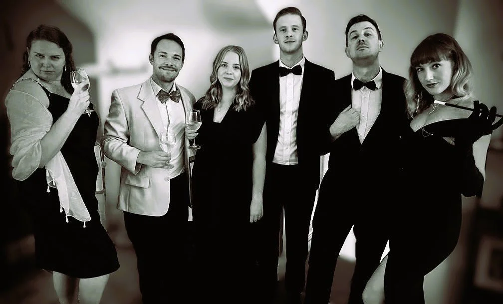 A new group of suspects gather together, to be interrogated by Detective Inspector Henry Quinn, in a 1940s-themed murder mystery.  Intrigue and suspense will abound!

𝐸𝑛𝑡𝑒𝑟 𝑡ℎ𝑒 𝑝𝑎𝑠𝑡, 𝑤ℎ𝑒𝑟𝑒 𝑒𝑙𝑒𝑔𝑎𝑛𝑐𝑒 ℎ𝑖𝑑𝑒𝑠 𝑑𝑒𝑎𝑑𝑙𝑦 𝑠𝑒𝑐