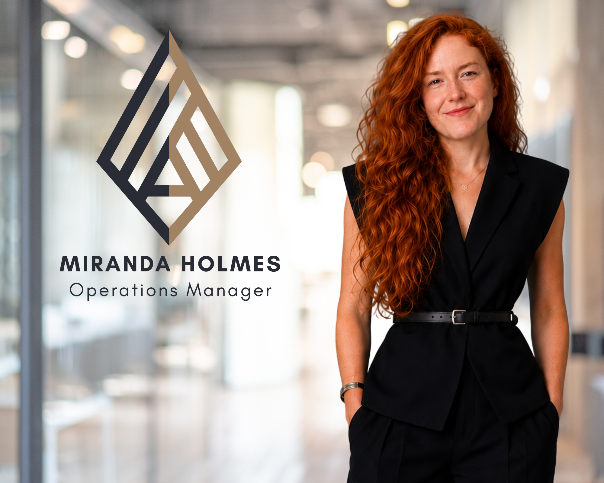 A woman with long, curly red hair smiling in a professional setting, wearing a black sleeveless blazer who works for LEGALLY BUILT construction law in Calgary.