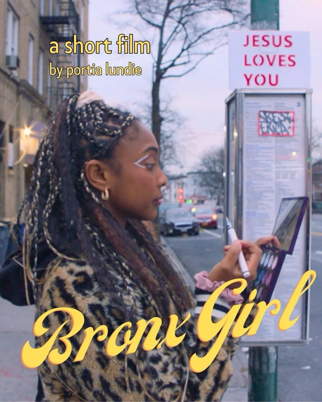 A woman with braided hair and leopard print coat standing on a city sidewalk, applying makeup while looking at a small mirror. In the background, a bus stop with a sign that reads 'JESUS LOVES YOU' and a city street with cars.