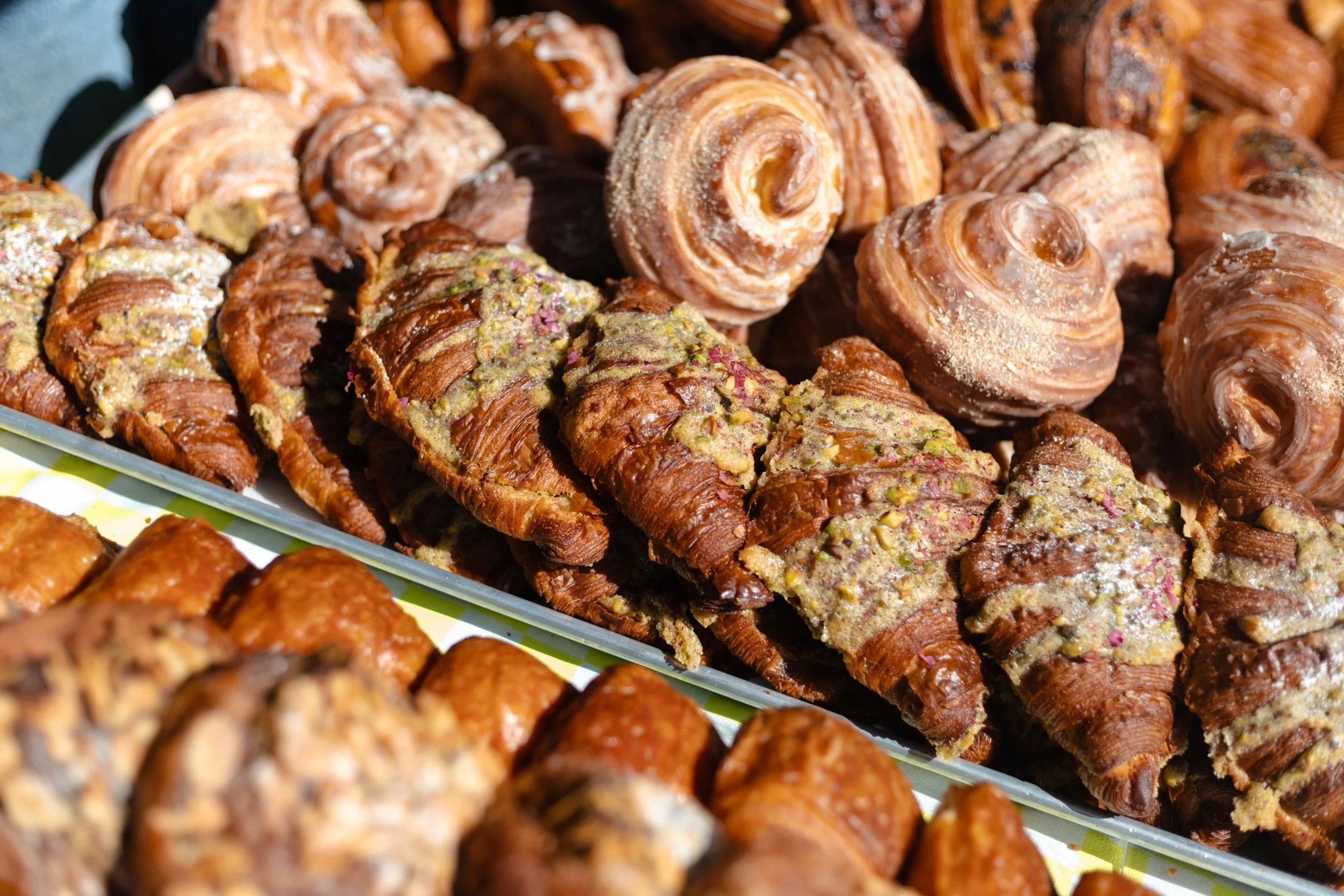 Assorted Indian Inspired french pastries - croissants displayed at farmers markets