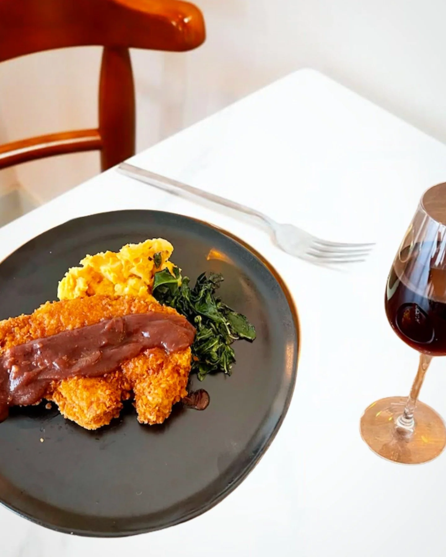 A beautiful plate, a thoughtful pairing, and a table waiting. 🍽️🍷

Our pork chop with smoked red wine apple butter, chard, and root vegetable mash pairs beautifully with a glass of our Four Daughters red &mdash; structured and expressive, complemen