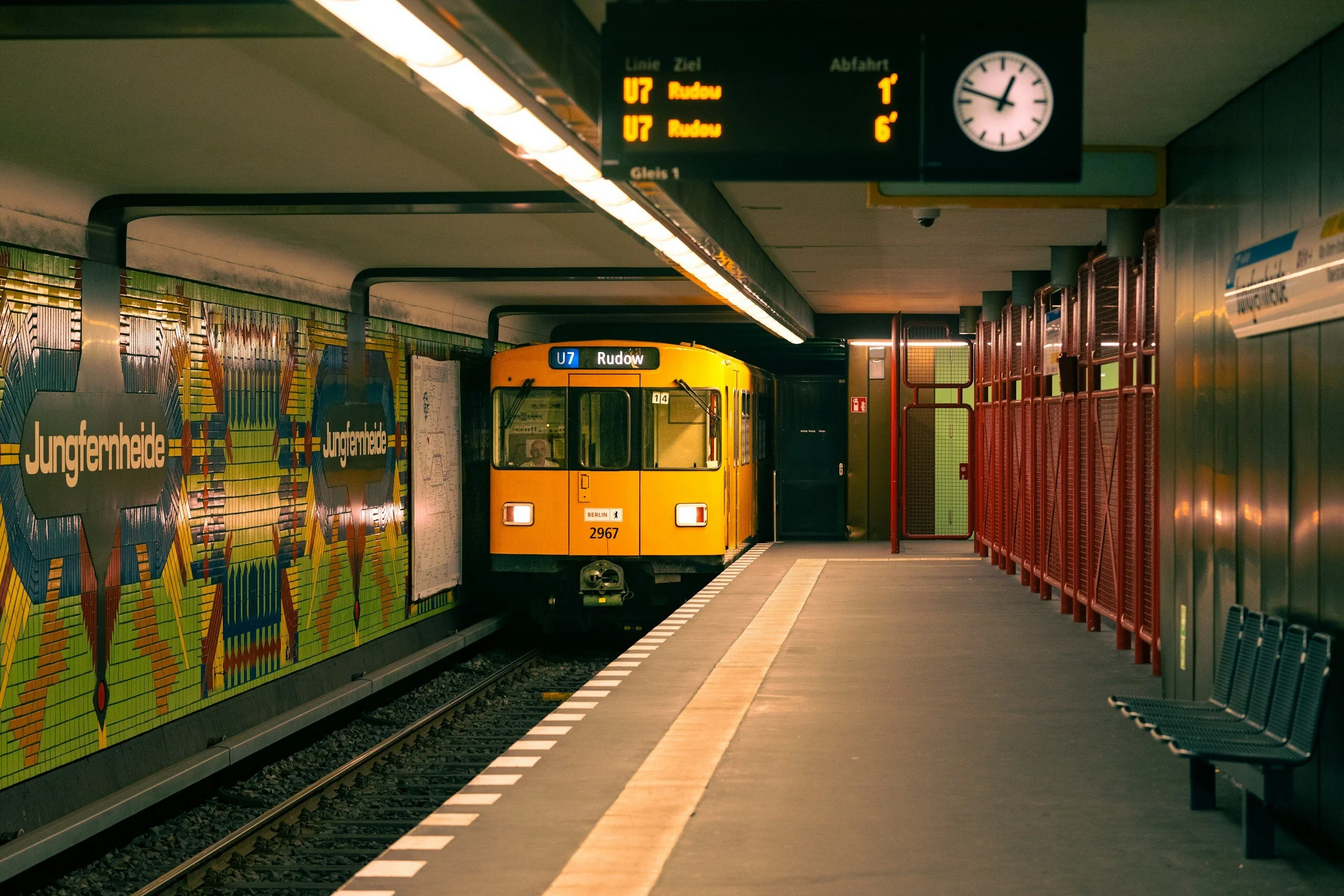 Yellow U-Bahn train arriving at a subway station in Berlin, Germany