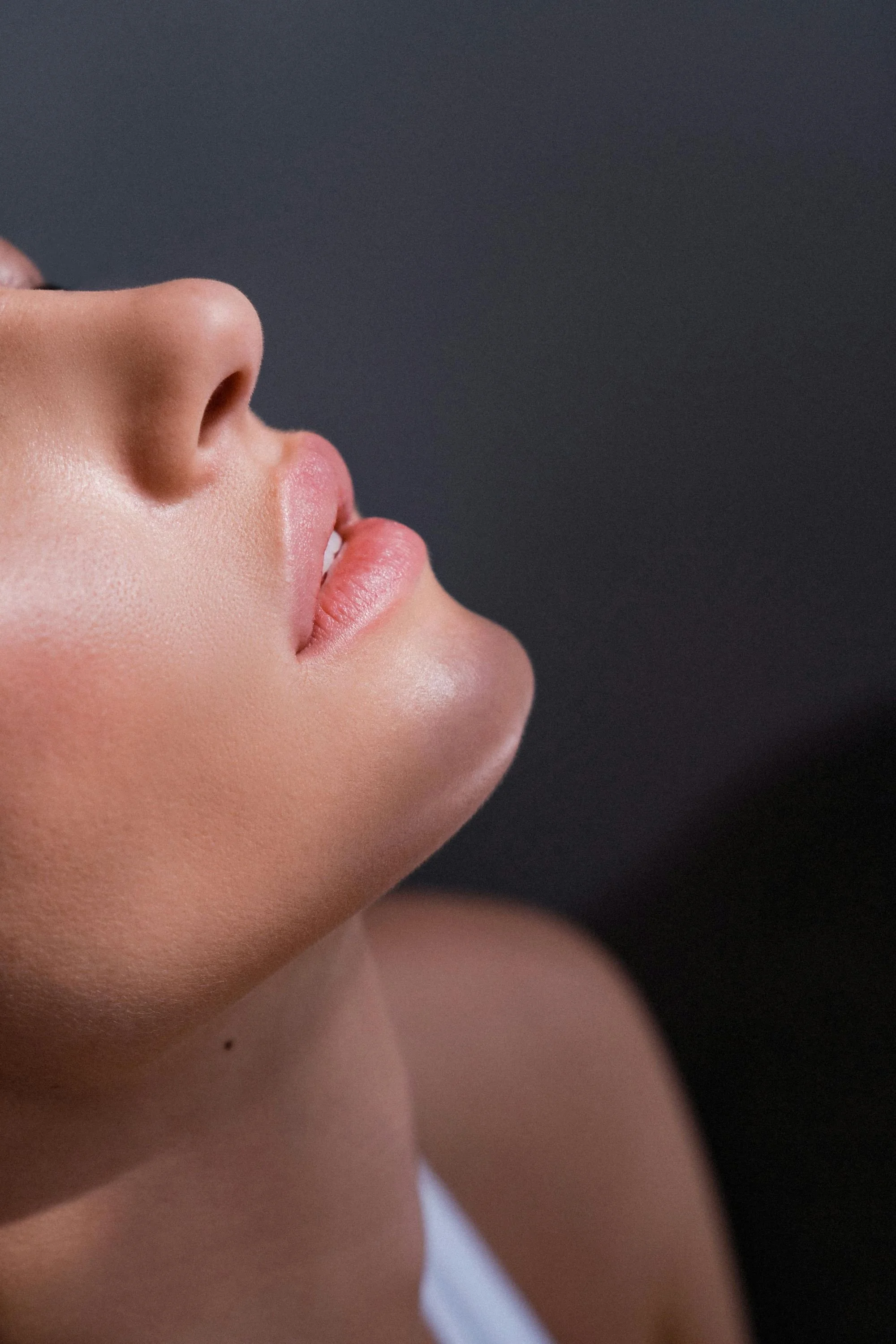 Close-up side profile of a person’s face highlighting smooth skin texture and natural contours.