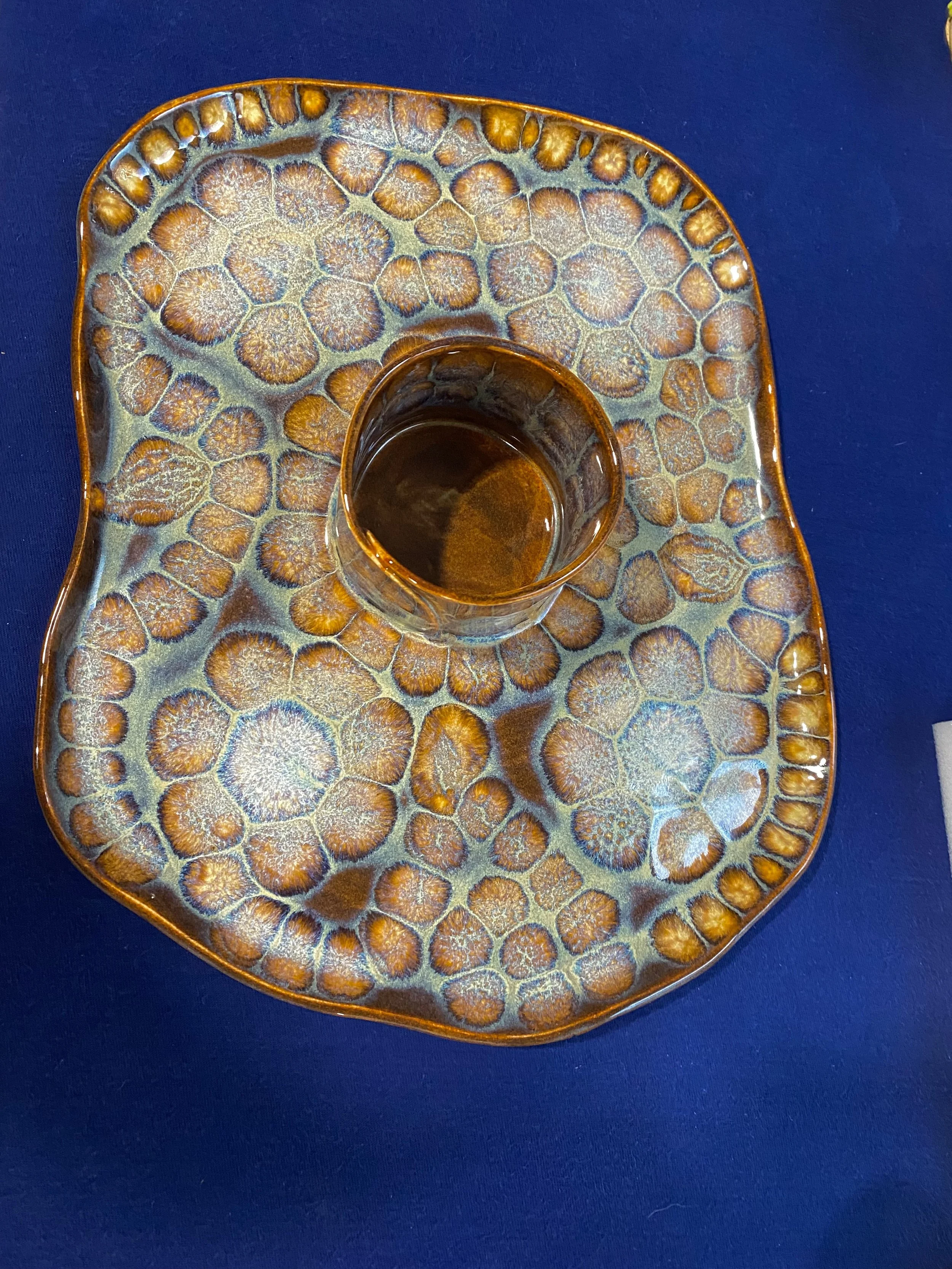 Dipping platter in  tortoise shell glaze with floral pattern