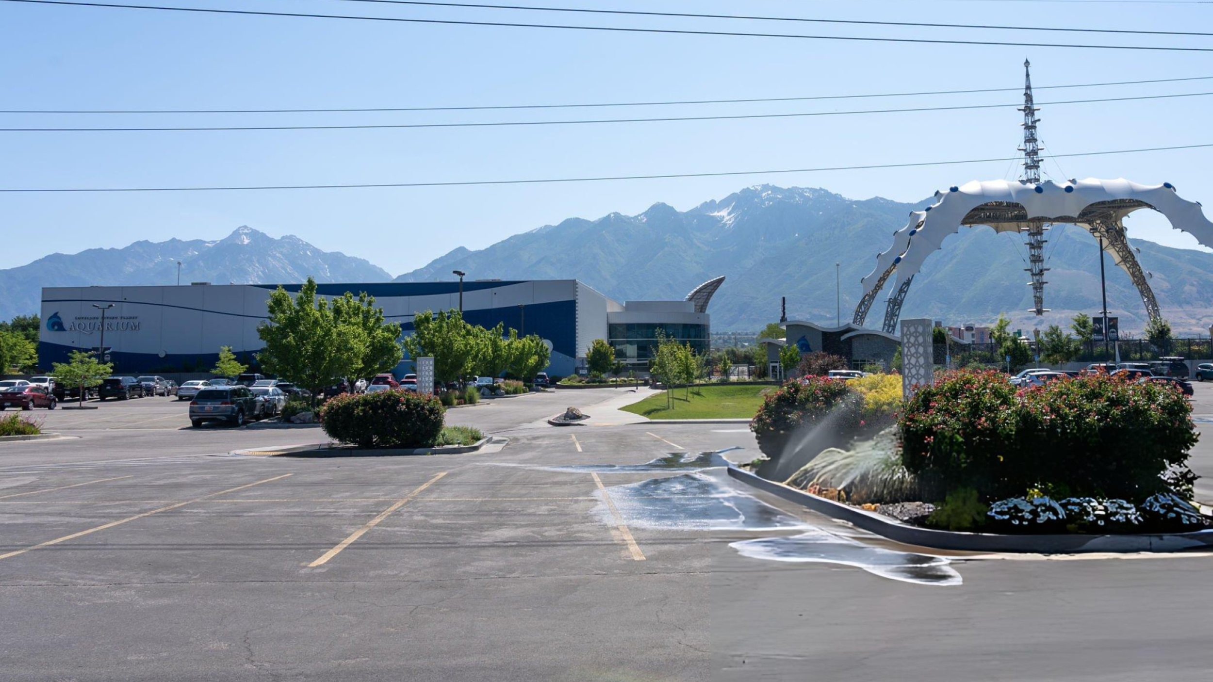 Loveland Living Planet Aquarium in Draper, Utah, set against the scenic Wasatch Mountain range, showcasing the area's blend of outdoor beauty, family attractions, and elevated living.