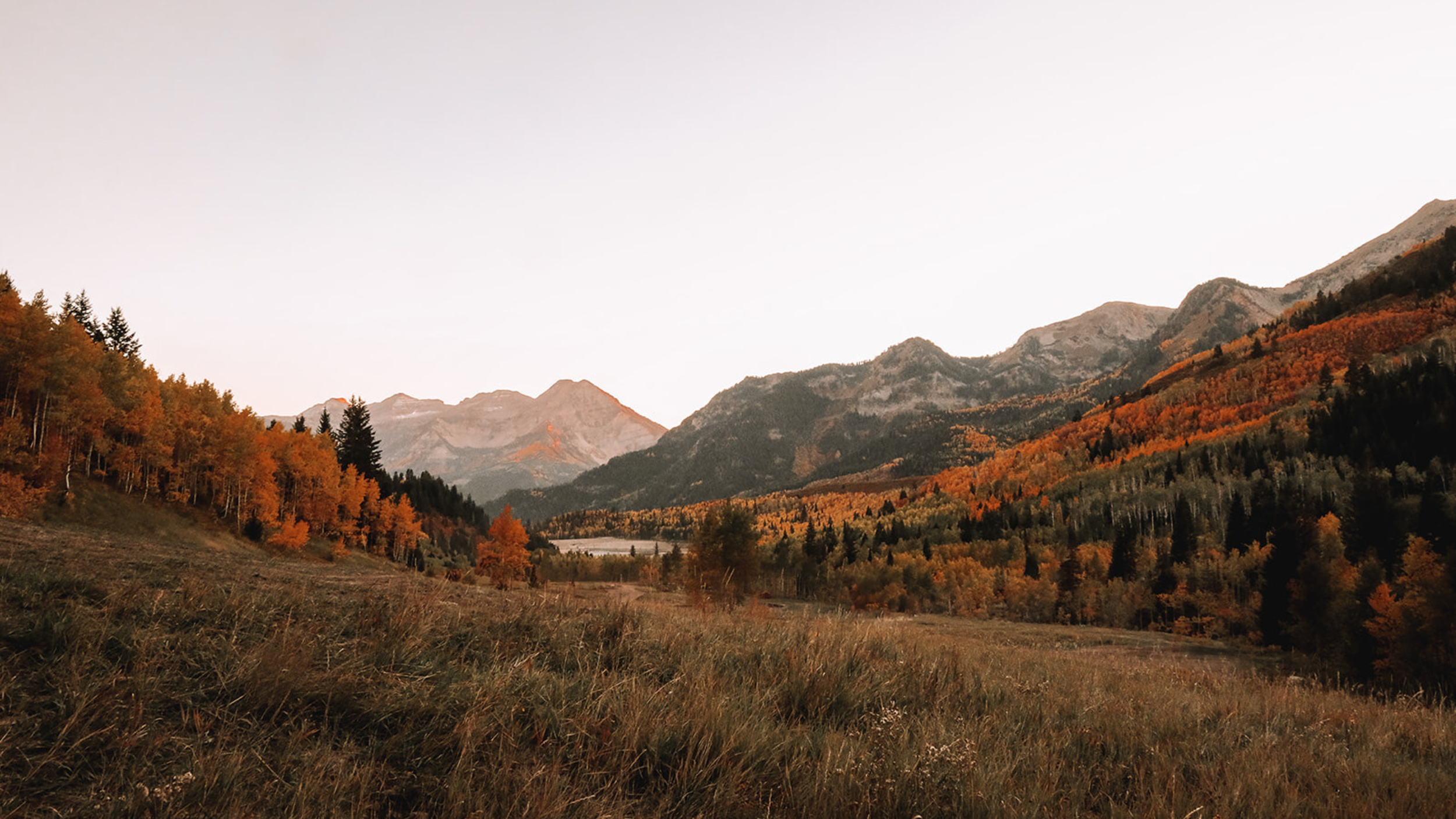 Scenic Utah mountain landscape surrounded by fall foliage, reflecting the outdoor lifestyle that can come with upgrading your home.