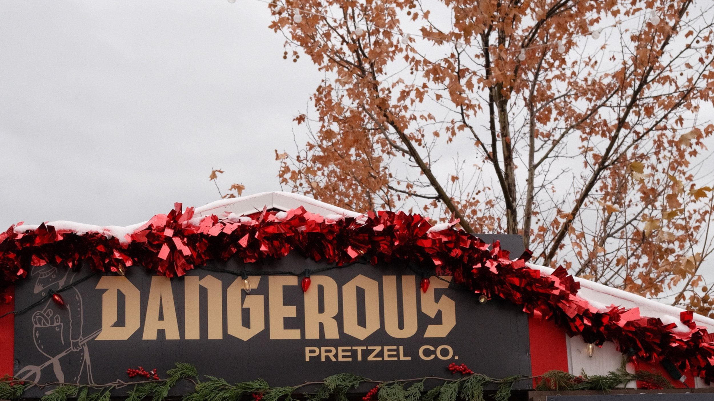 Dangerous Pretzel storefront decorated for fall, representing the local businesses and neighborhood lifestyle to consider before planning a Utah move.