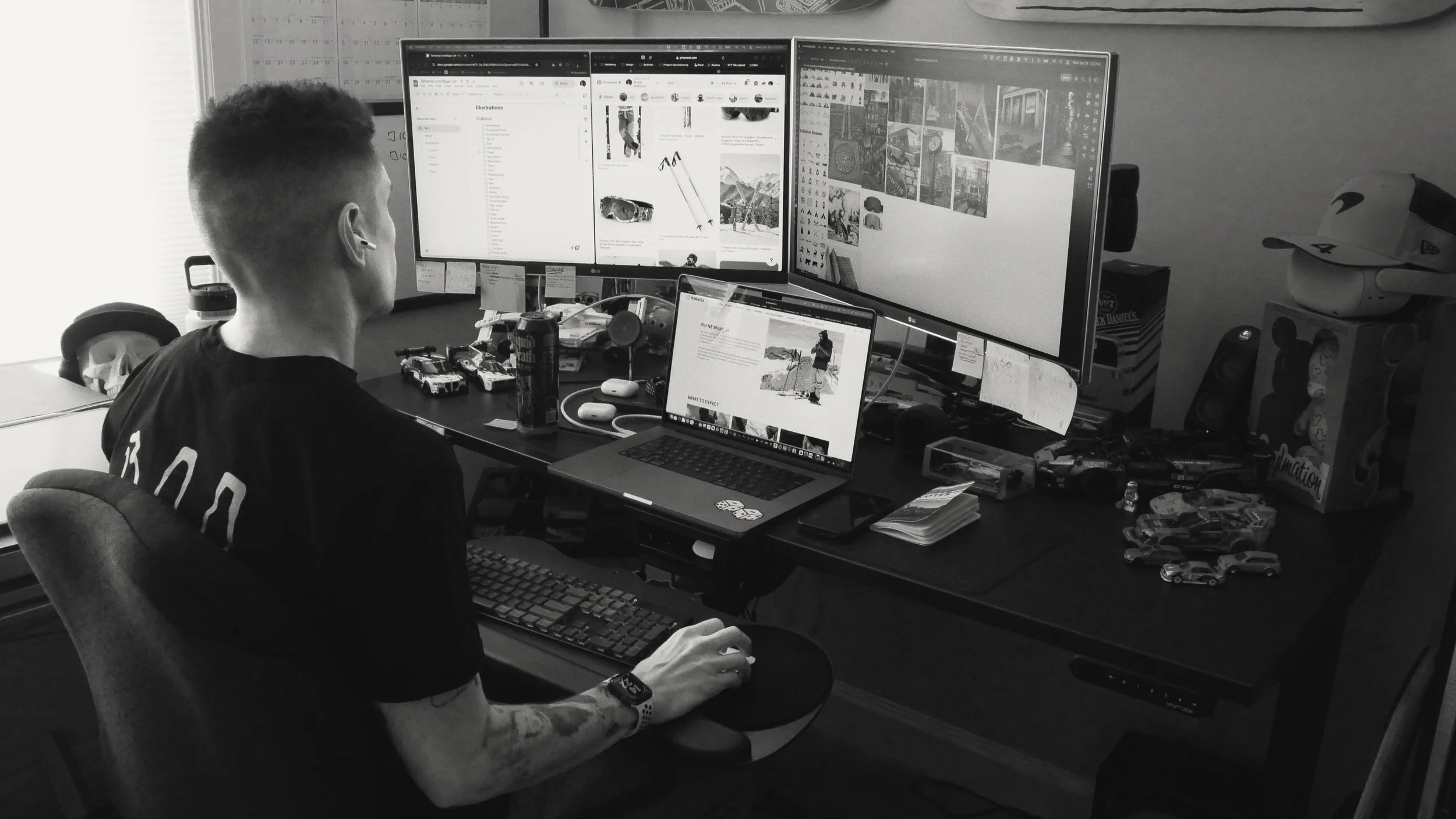 Scott Hofford working at multi-monitor setup conducting brand research