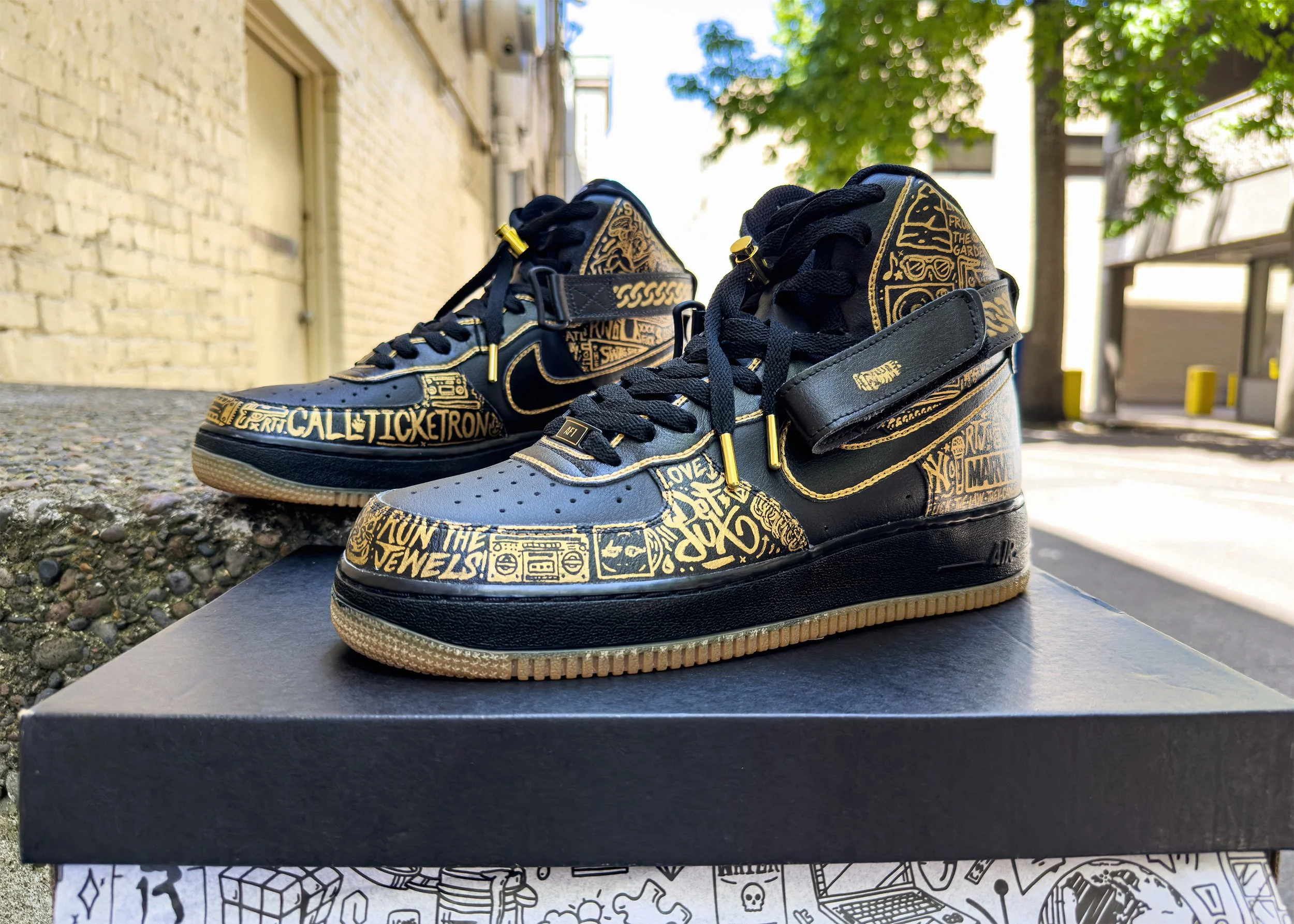 Custom painted Run the Jewels Nike Air Force 1 sneakers with gold Iconoflage