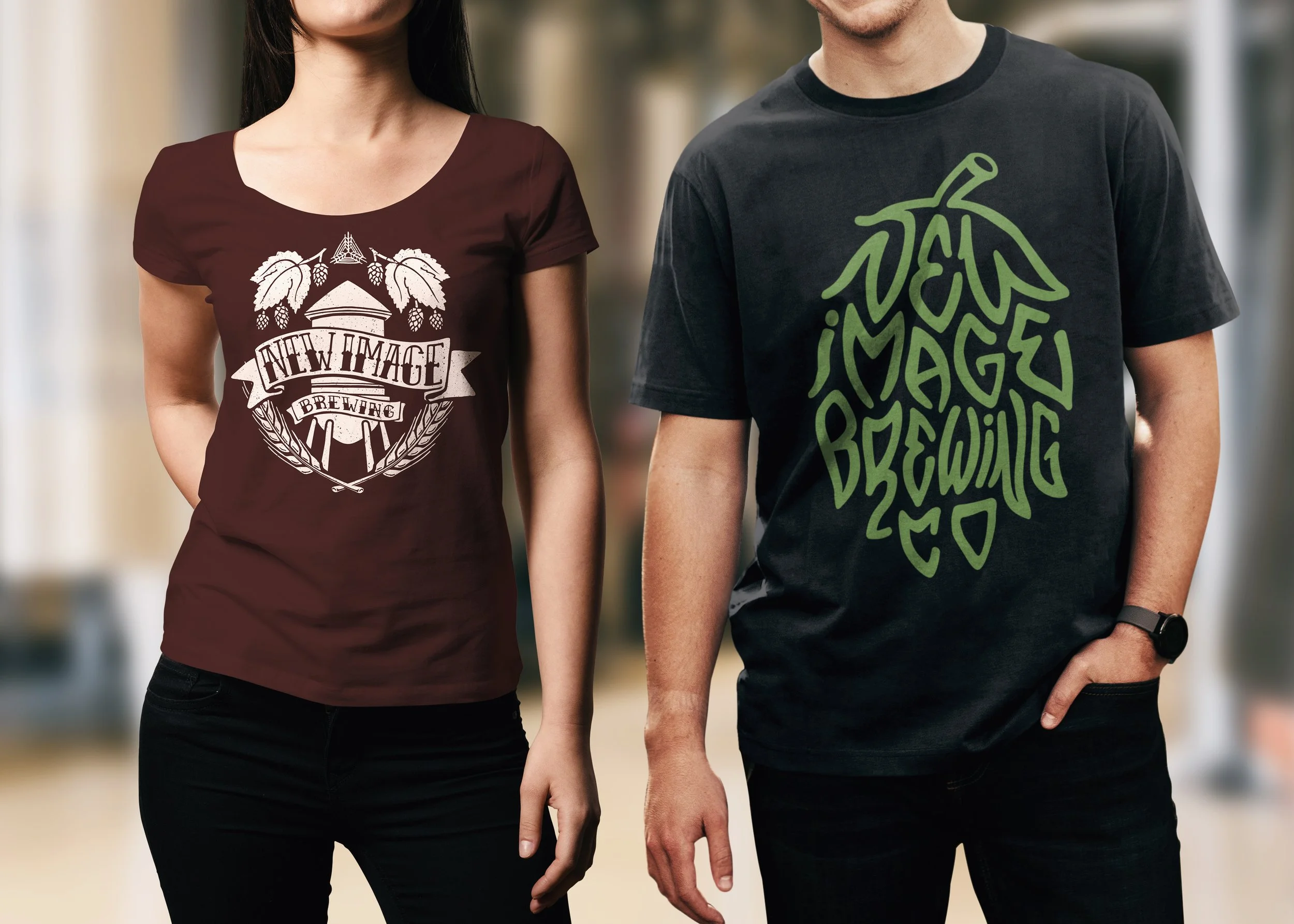 Two models wearing New Image Brewing apparel: maroon women's t-shirt with water tower design and black men's t-shirt with hop lettering design