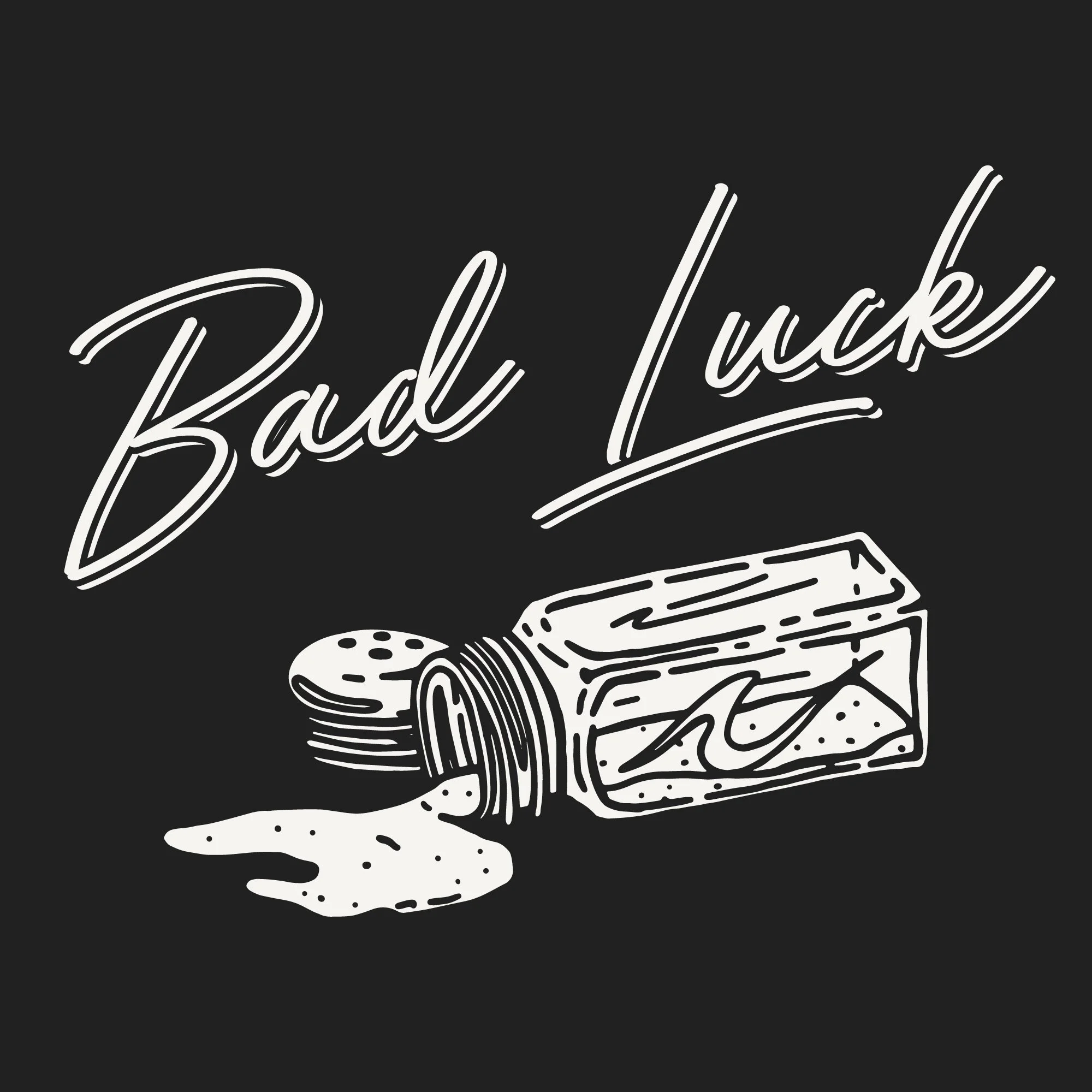 Black and white illustration of knocked over salt shaker with Bad Luck script