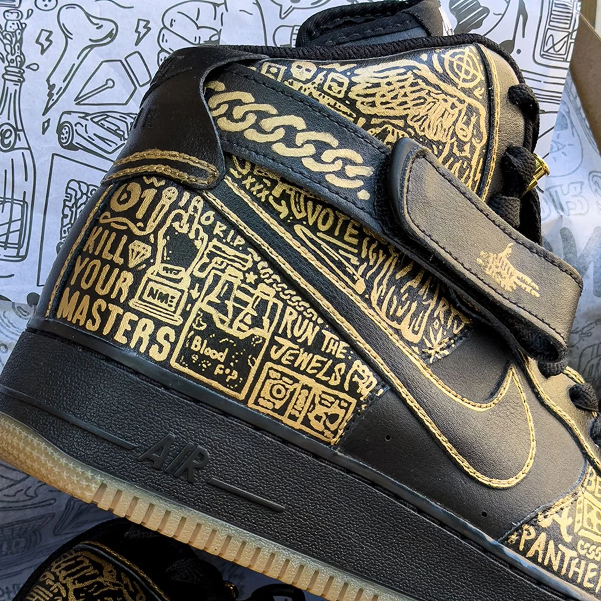 Custom painted Run the Jewels Nike Air Force 1 sneakers with gold Iconoflage