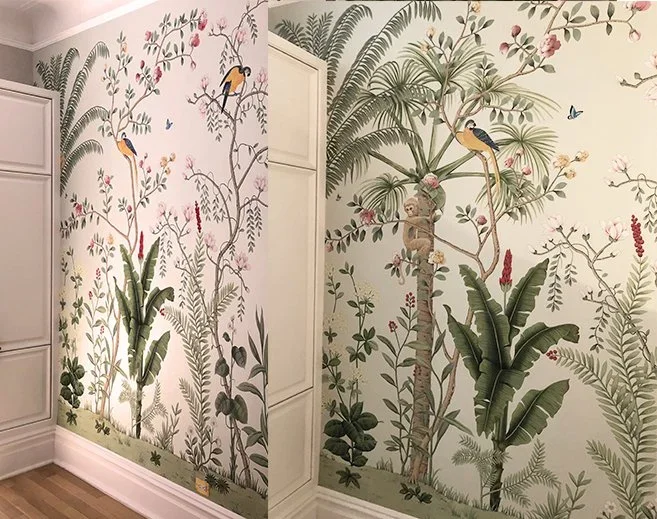 Wall murals depicting a lush jungle scene with tropical plants, birds, butterflies, and a koala in trees.