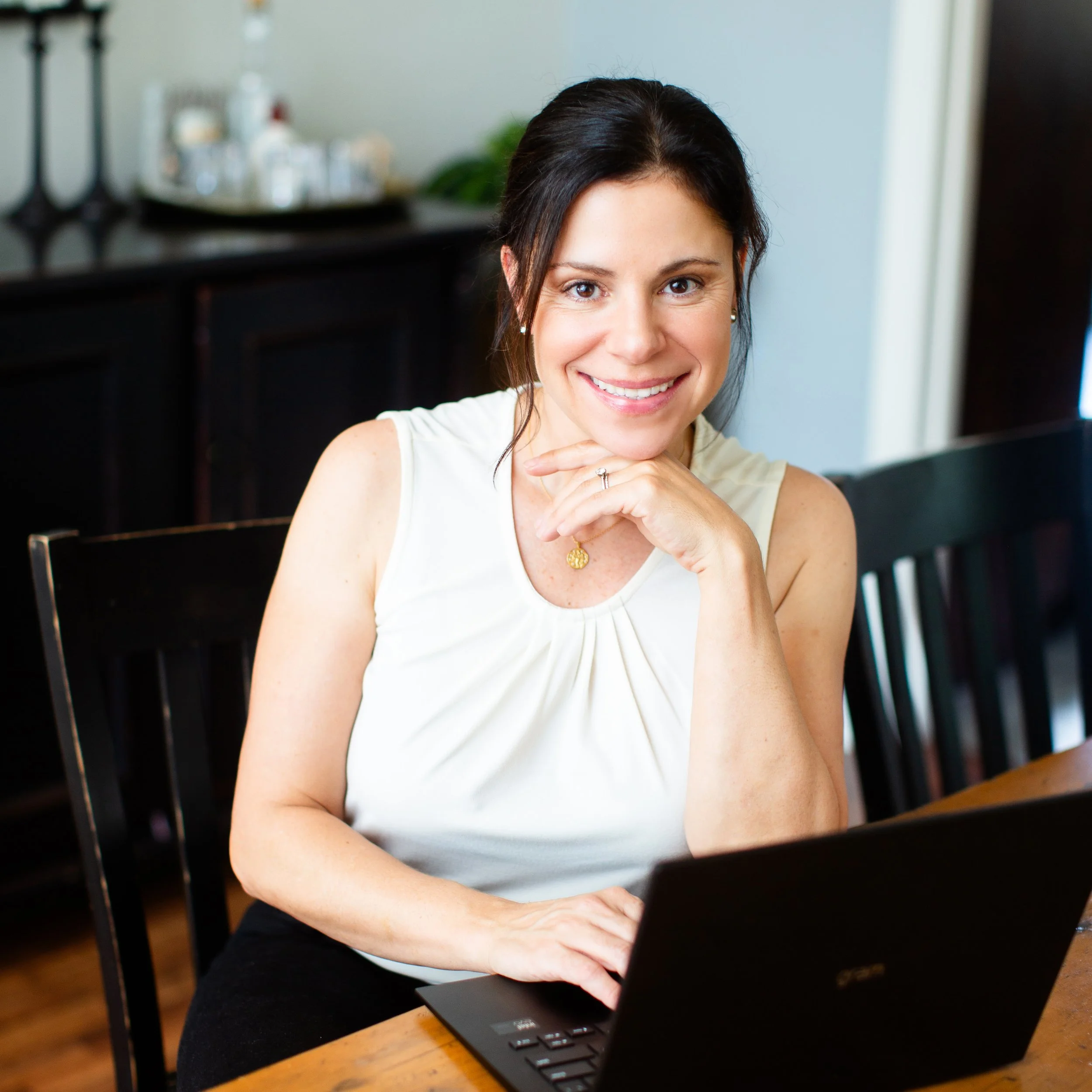 Christina Hutchison, daily money manager at home office in Dana Point