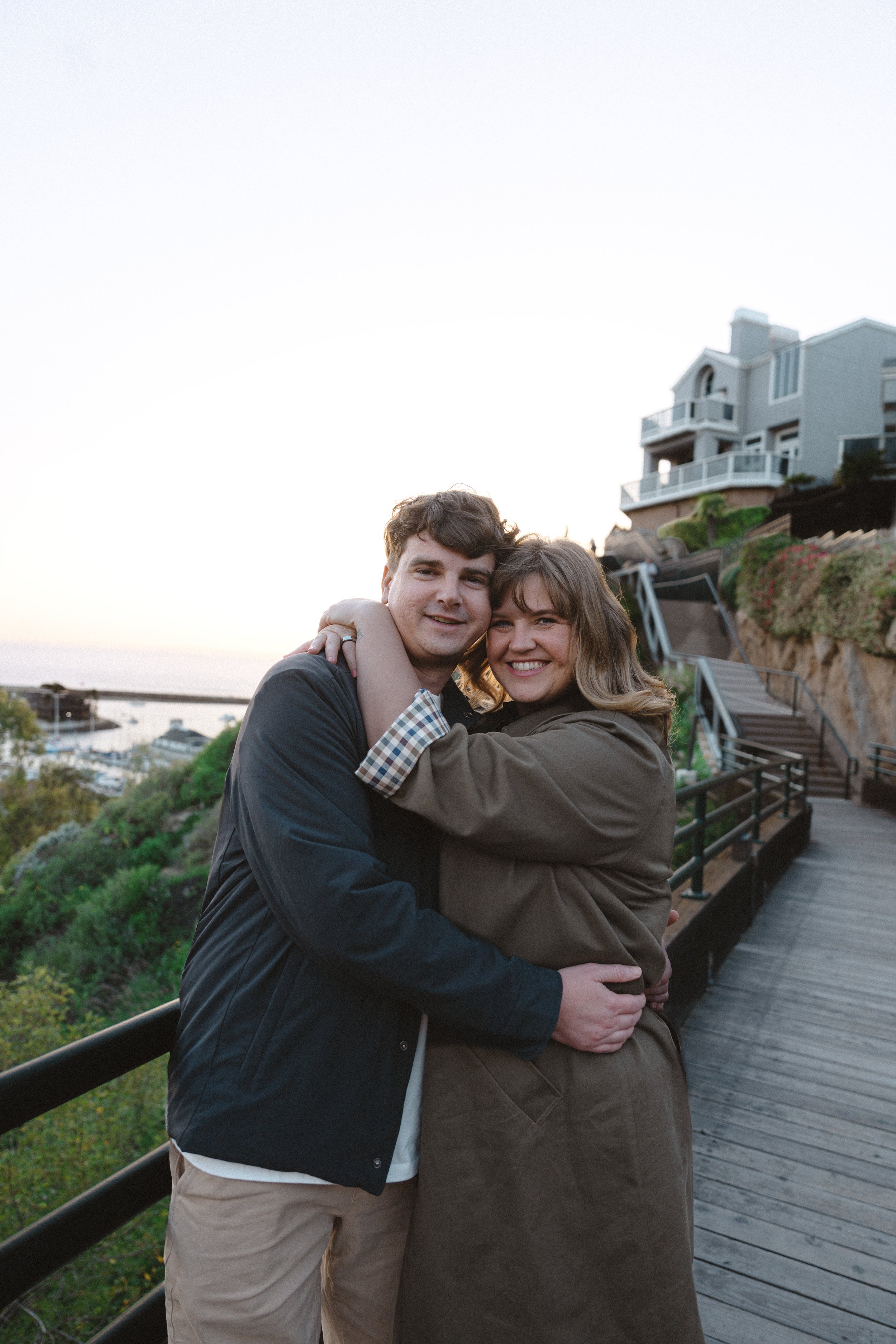 Couples photography session at Dana Point Bluff Trail overlooking Dana Point Harbor by The Salt and Serenity Photography